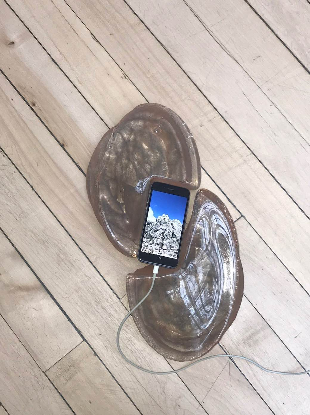 Sand cast glass with screen placed between